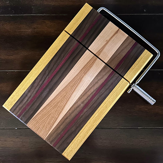 Cheese cutting board with slicer